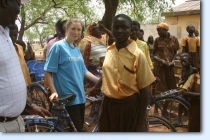 Image copyright: Jill Westenra - Hayley, with several bikes, and just a few of the many friends she met while in Ghana